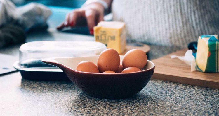 Cooking in the kitchen with eggs and butter.