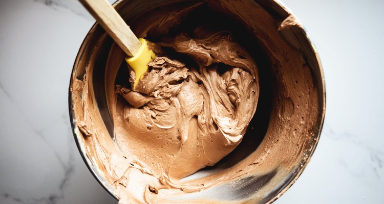 The chocolate buttercream will be thick, fluffy and hold its shape when it is done.