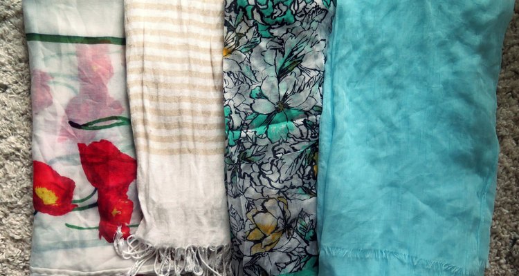 Wear a solid or printed lightweight scarf to add a pop of spring to your outfit.