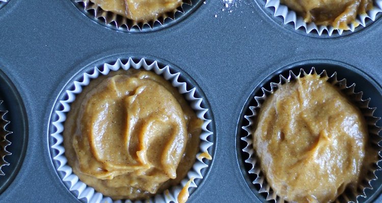 Muffin cups filled with batter.