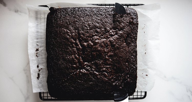 Let the cakes cool before using a sharp knife to remove any domed tops.