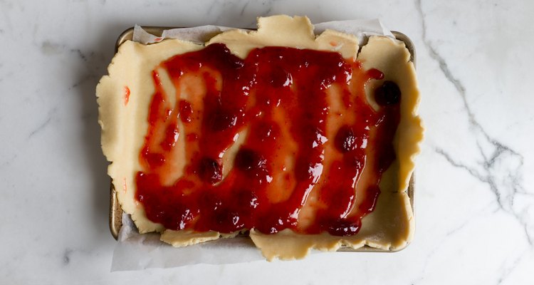 Spread the strawberry jam over the base.