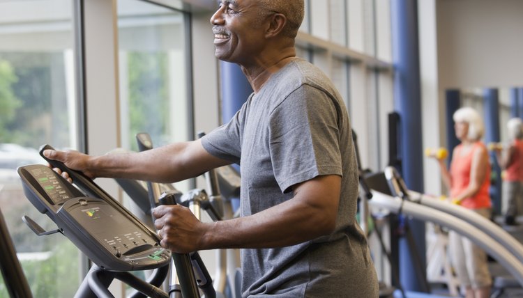 African man working out on elliptical machine