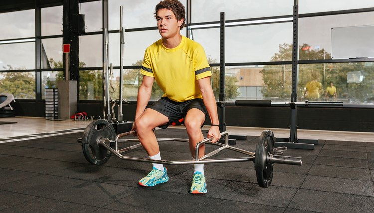 Young man doing exercise at gym