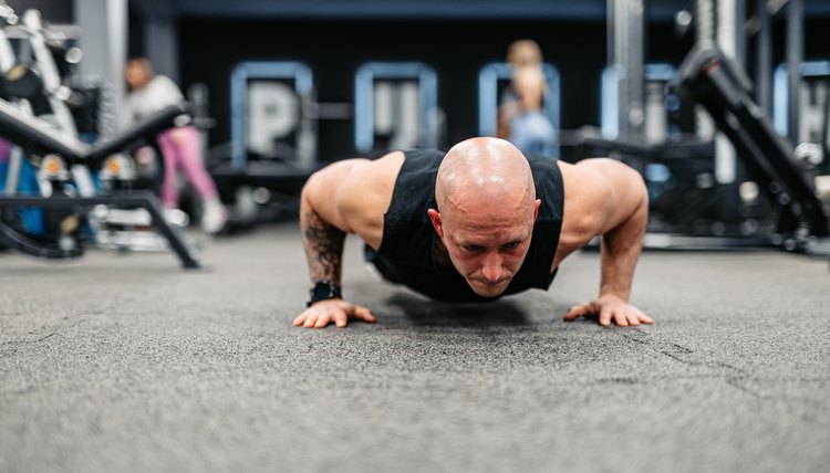 Young Man Doing Push-Ups At The Gym