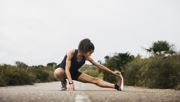 Athlete woman running warming up