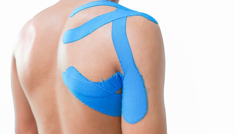 Man with kinesiotaping on the shoulder