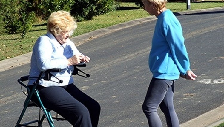 A woman rests after using her walker.