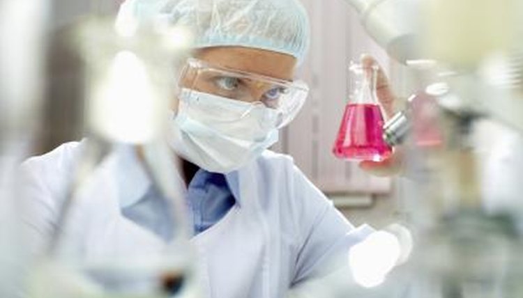 Scientist examining beaker