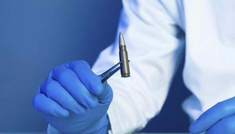 Studying a bullet.