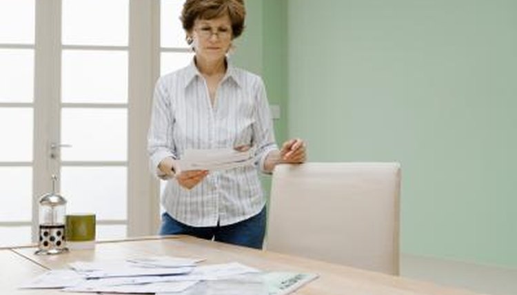 Woman with checks and mail.