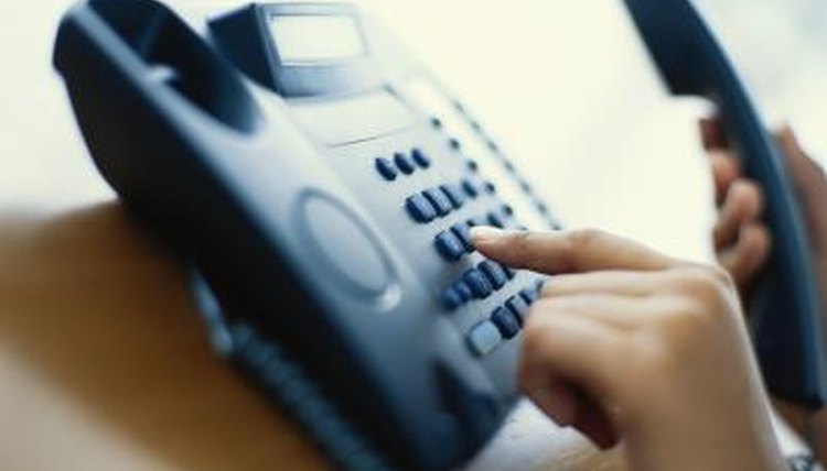 Person dialing on phone