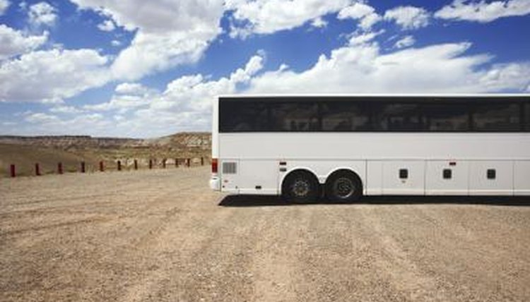 Bus parked in dirt lot