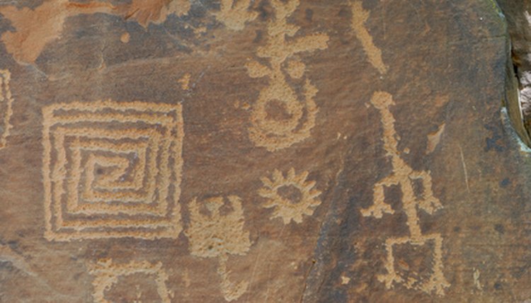 Designs like the ones on this petroglyph also appear on some Anasazi pottery.