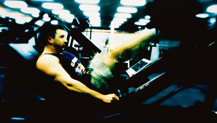 Man doing leg presses in gym