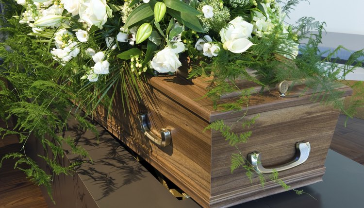 A bouquet of flowers on a coffin.