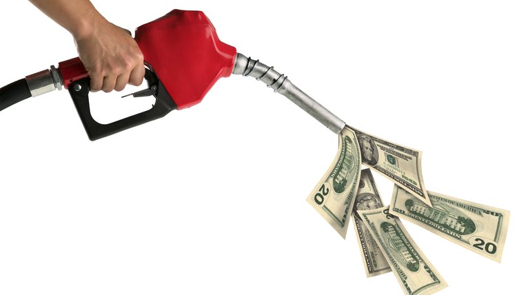 A woman's hand holds a red gas pump pouring out American dollar bills.