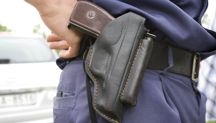 Police officer`s holster with gun.