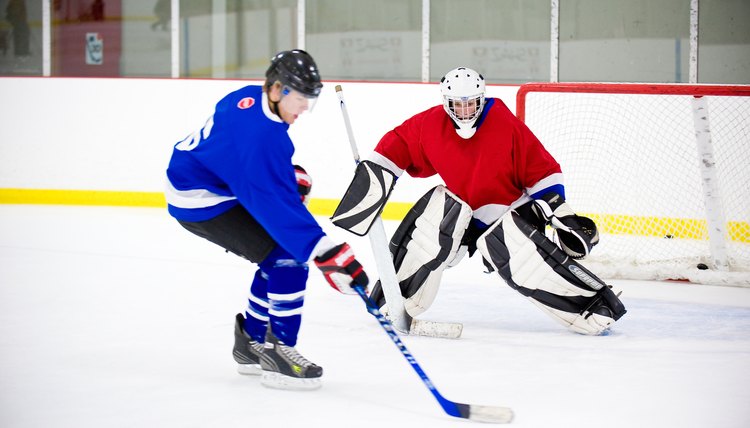 Ice hockey goalie blocking goal