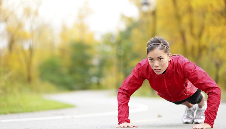 Crossfit woman doing push-ups