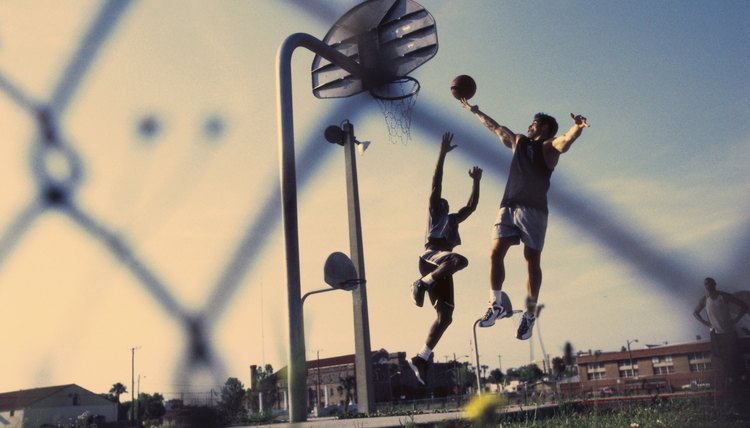 Low angle view of two men playing basketball