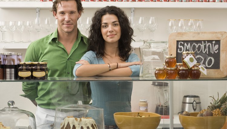 Couple posing in pastry shop