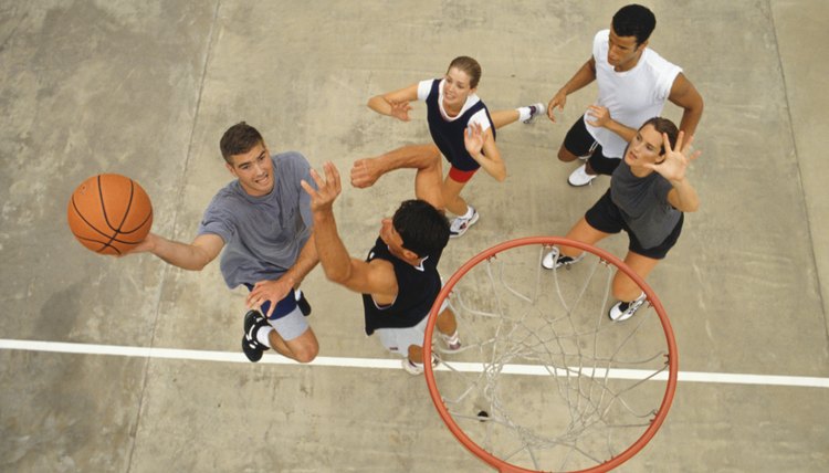 Group of young people playing basketball, elevated view