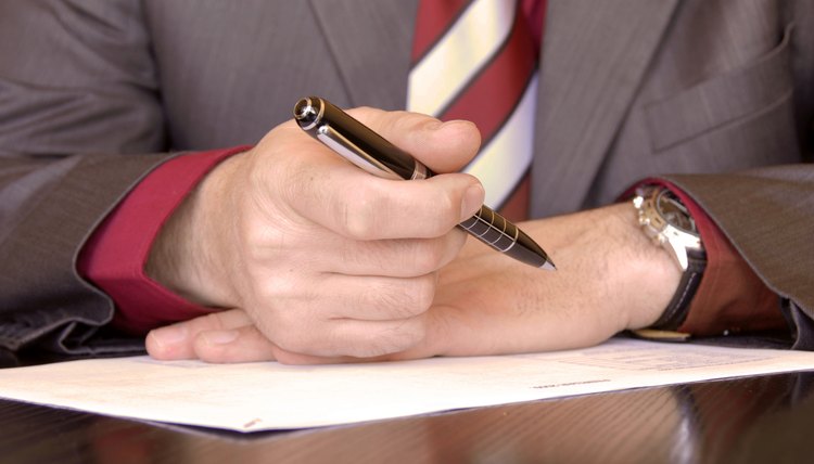 Close-u of man handwriting a letter