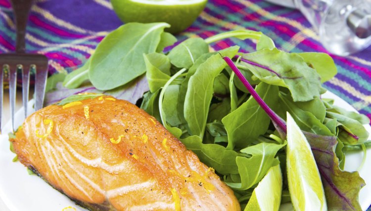 Grilled fillet red salmon and salad with lettuce, lime