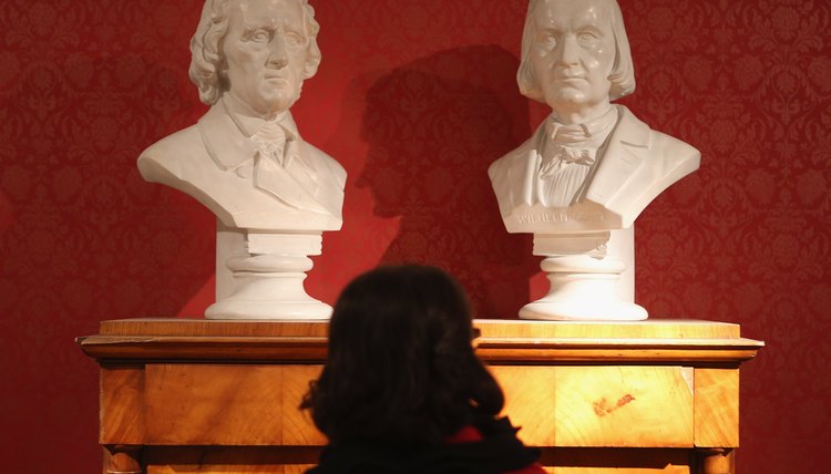 Busts of brothers Jacob and Wilhelm Grimm, who were both devout Calvinists.