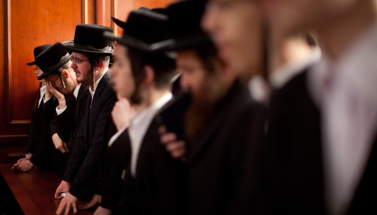 Orthodox Jewish men wear payos, or side curls.