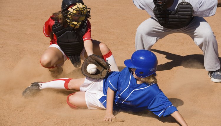 Softball Player Sliding Into Home Plate