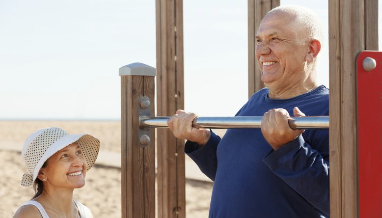 mature couple training with chin-up bar