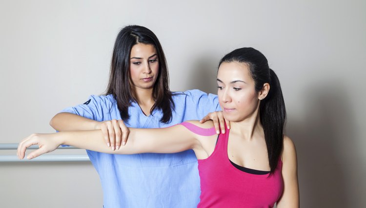 Patient at physiotherapy with tapes