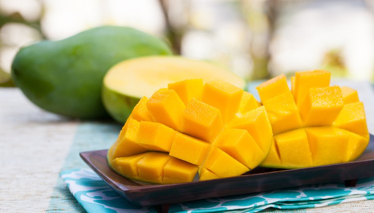 Fresh mango organic product on a tropical outdoor background