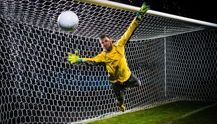 Soccer Goalie Jumping For Ball