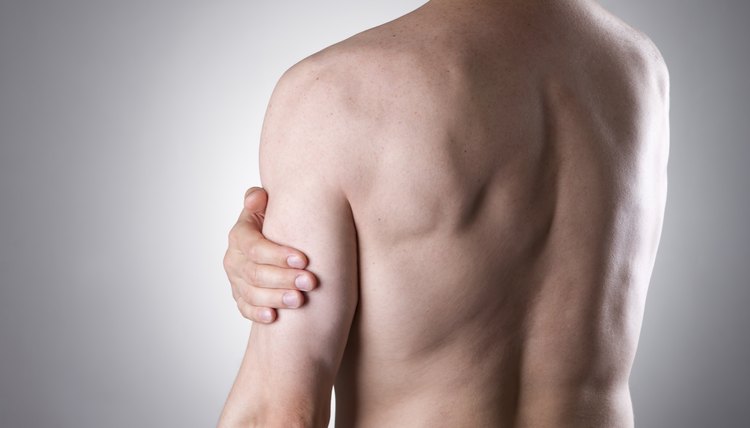 Man with pain in shoulder. Pain in the human body