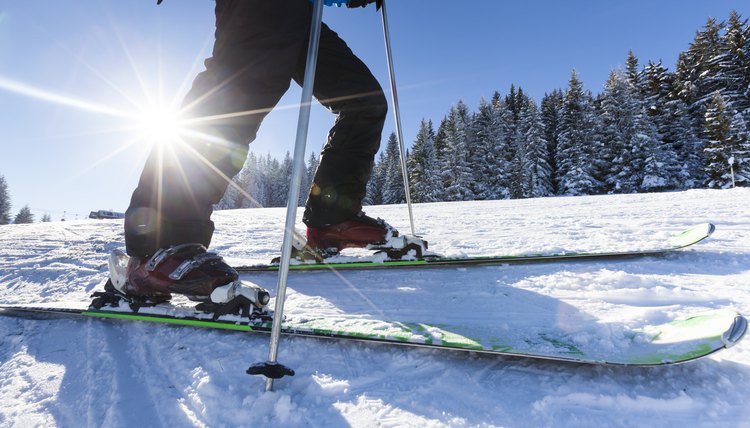 Close up skier ski shoes and snow