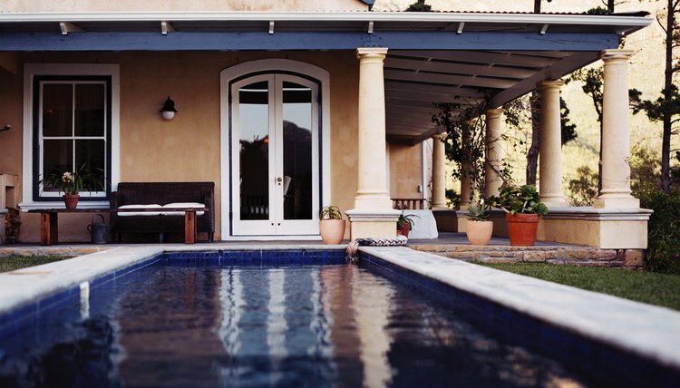 view of a swimming pool in the backyard of a house