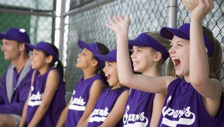 Little league team in dugout cheering