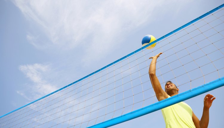 Hispanic man playing volleyball