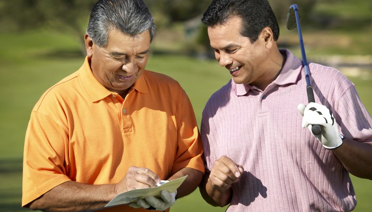 Portrait of two men golfing