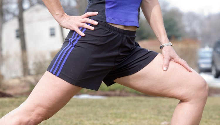 Woman stretching outdoors before exercise