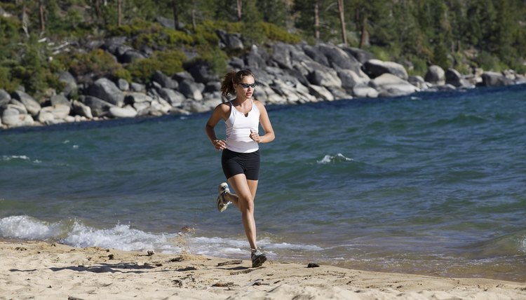 Woman running on beach,  Lake Tahoe,  California,  USA