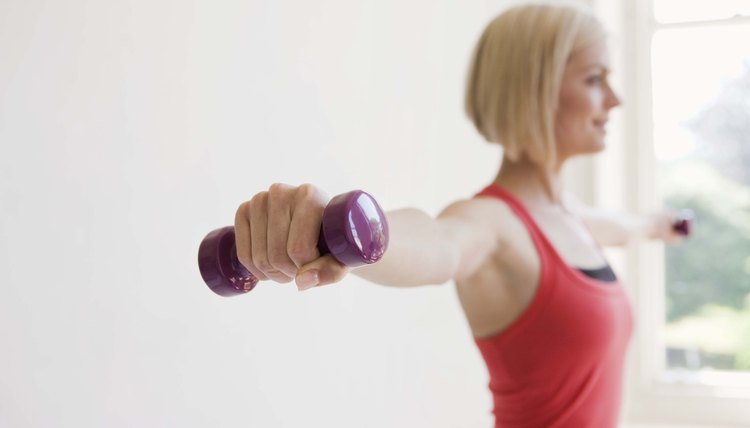 Woman exercising with dumbbells