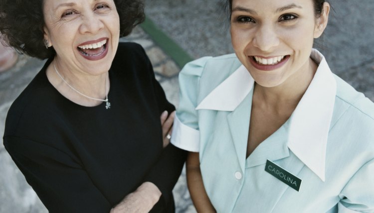 Elevated Portrait of a Hotel Manager and Hotel Maid Standing Side by Side