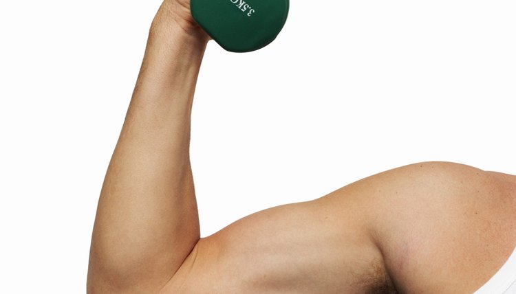 Close-up of man's hand lifting dumbbell