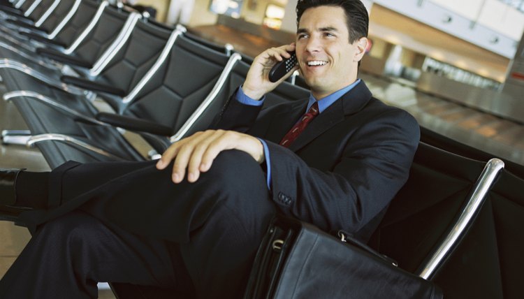 Man talking on cell phone in airport