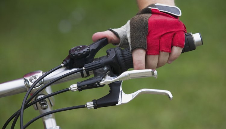 Hand on bicycle handlebars