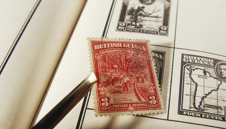 Placing stamp into album